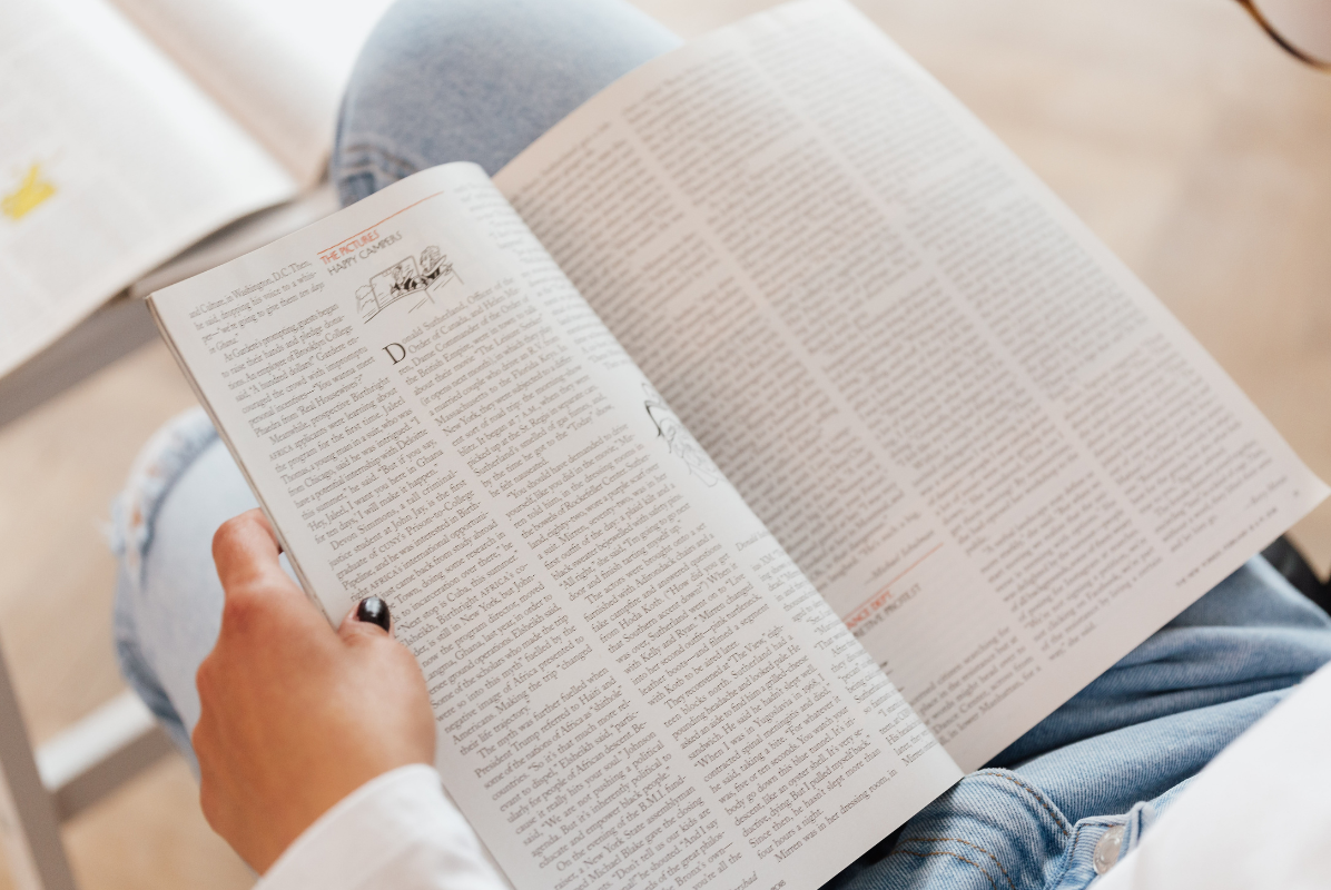 person reading magazine
